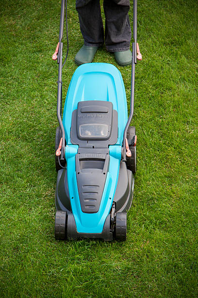 istock man with an electric mower 503136345