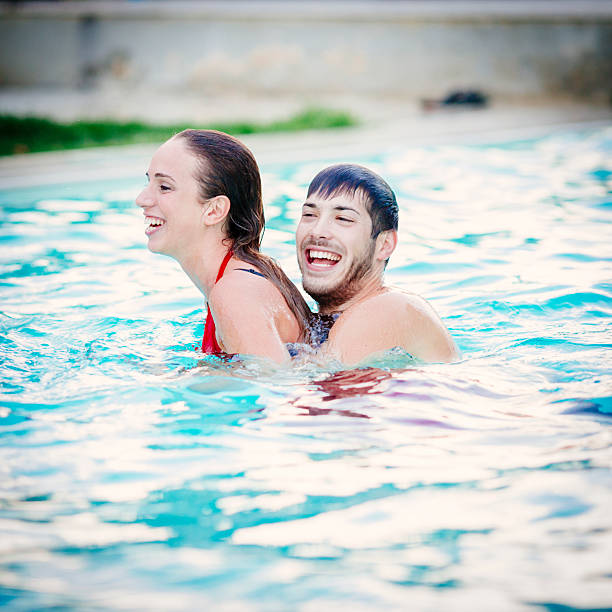 istock Couple having fun in the swimming pool 503137195
