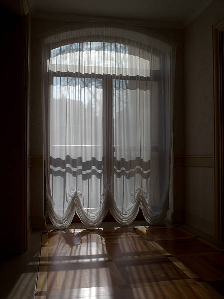 curtains curtains are hanging on the window bed and nightstand classic curtains stock pictures, royalty-free photos & images