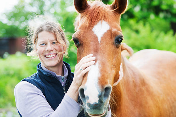istock Female veterinarian with her horse 503137519