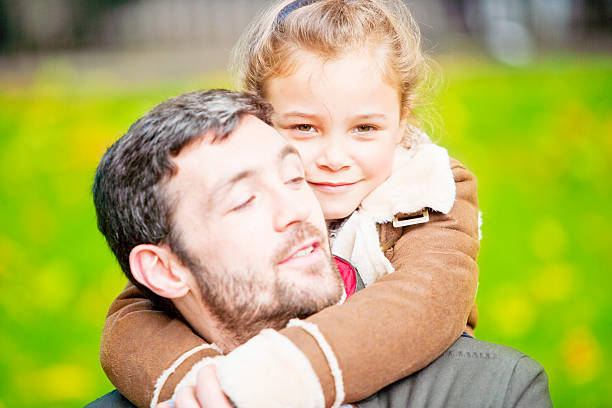istock Father and daughter in a London`s park 503137757