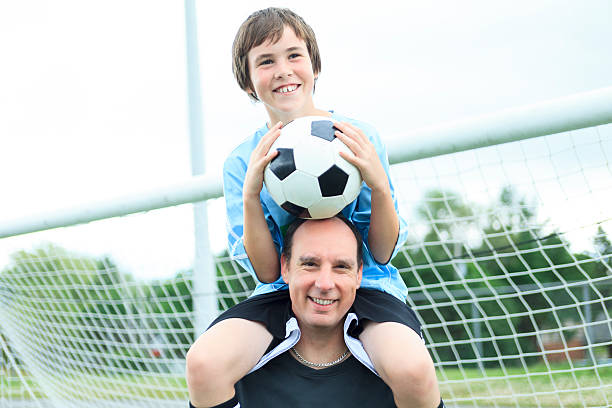 istock Father Son Football on Shoulder 503138499