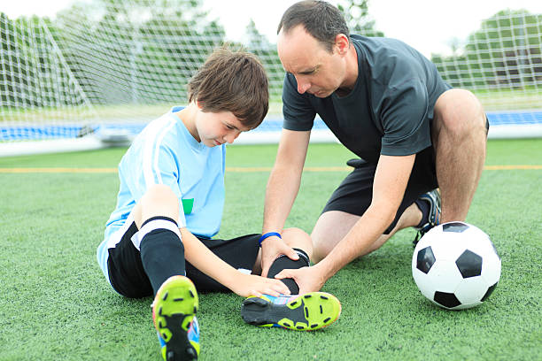 istock Father Son Football - Injury 503138531