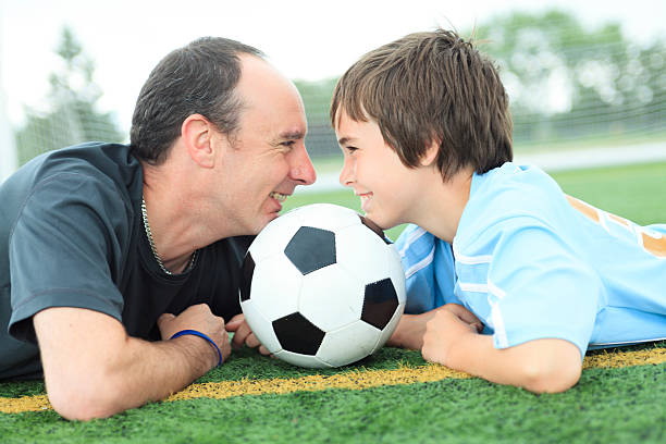 istock Father Son Football Chin 503138545