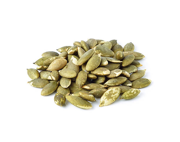 istock Pumpkin seeds on a white background 503139110