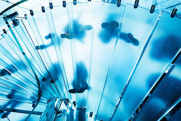 istock People on Blue, Glass, Spiral Stairs, Low Angle View 503139277