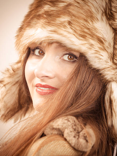 istock woman wearing wintertime clothes fur cap 503140302
