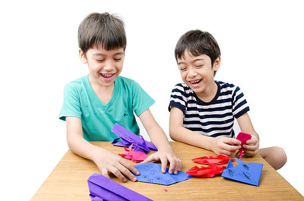 istock Little boy playing on paper art origami 503144352