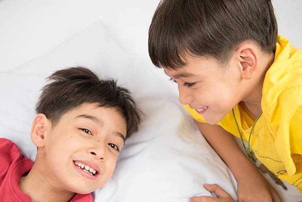 istock Little sibling boy lay on the pillow  together 503145076