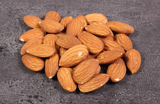 istock Heap of almonds on concrete structure 503145174