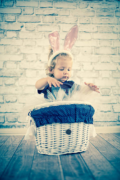 istock Cute baby bunny in the basket 503147913