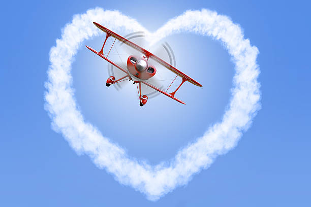 istock Biplane creating a heart shape in the sky 503149465