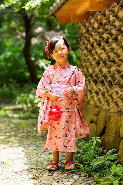 istock Little girl with water balloon 503149983