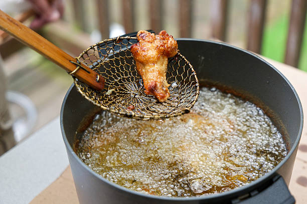 istock Boiling Oil Deep Fat Fryer Chicken Wing Wood Handle Strainer 503151847
