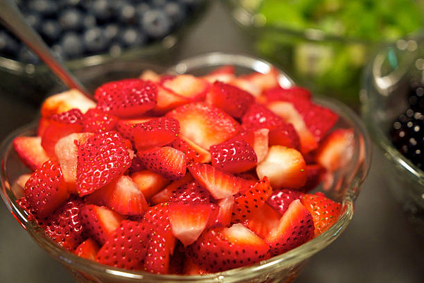 istock Bowls Fresh Fruit Sliced Strawberries Blueberries Kiwi 503151857