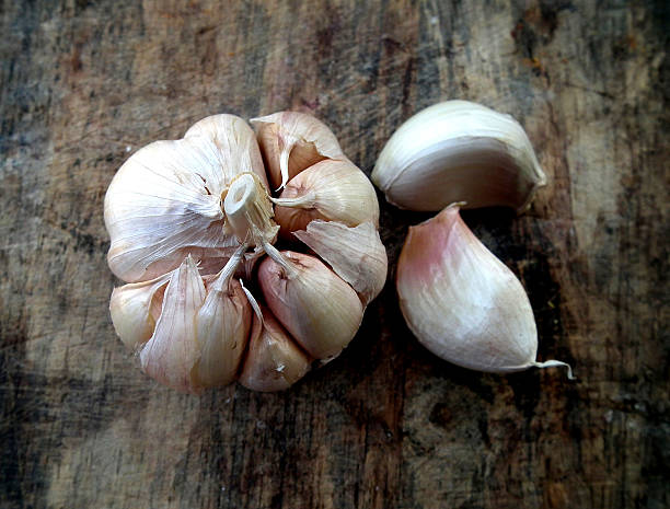 istock garlic on brown wooden background 503152485