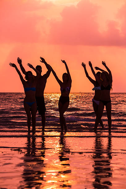 istock Multi ethnic friends having fun at the beach 503153481
