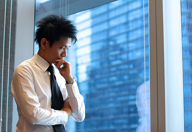 istock Asian Businessman Deep In Thought 503153603