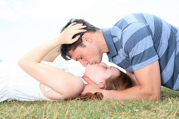 istock Grass Couple - Lay Kiss Lover 503154099