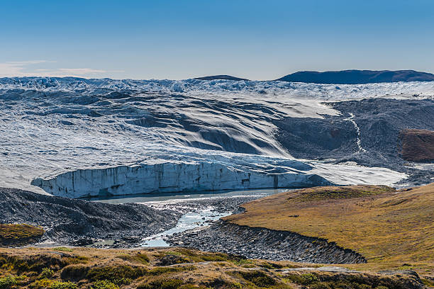 Greenland ice sheet Greenland ice sheet near Kangerlussuak. The Greenland ice sheet is a vast body of ice covering 1'710'000 square kilometres, roughly 80% of the surface of Greenland. greenland stock pictures, royalty-free photos & images