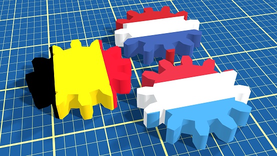 Politic and economic union members flags on cog wheels. Blueprint surface backdrop. Benelux