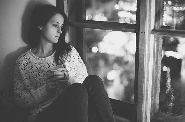 istock Thoughtful girl looking through the window 503162626