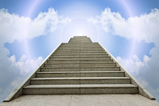 istock concrete staircase going up into a blue sky 503165470