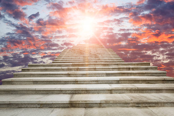 istock concrete staircase going up into sunrise clouds sky 503166194