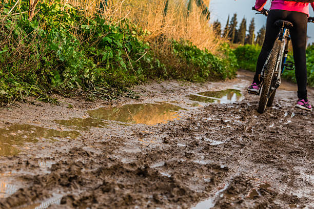 istock Bicycle ride through muddy dirt road 503166984