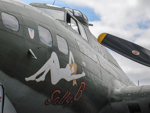 Duxford, Cambridgeshire, UK - June 26, 2005: B-17 nose art of a Boeing flying fortress bomber used in world war 2. Located on permanent, static display on a runway for public viewing.
