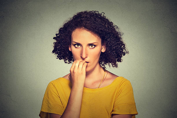 istock nervous woman biting her fingernails craving something anxious 503168706
