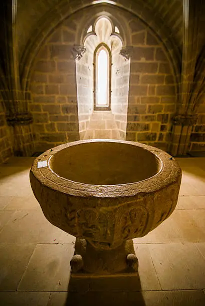 An baptismal font at the church of the village of Ujué, Navarra, Spain.