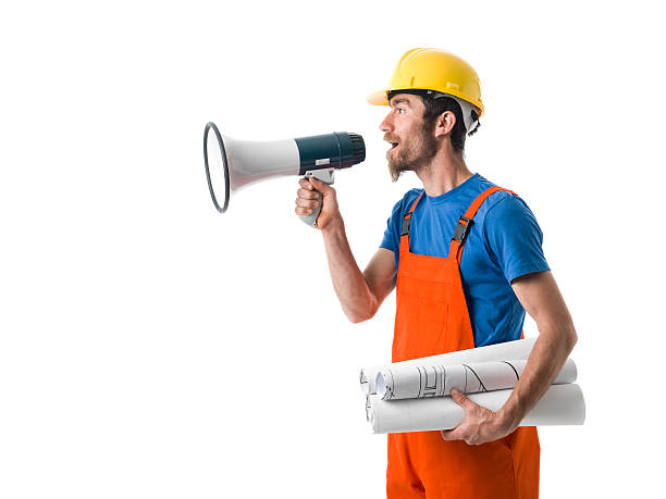 istock Adult Worker With Hardhat Shouting With Megaphone 503169704