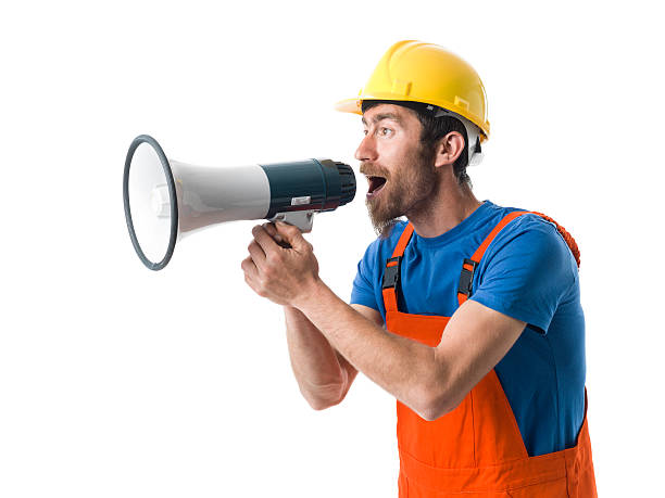 istock Adult Worker With Hardhat Shouting With Megaphone For Strike 503169742
