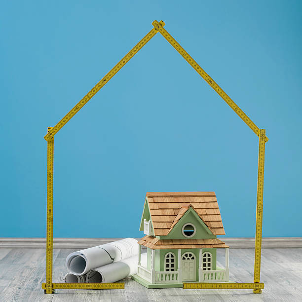 istock Model House And Blue Prints In On The Floor 503170020