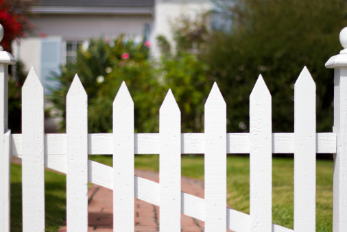 The American dream: a bungalow with a white picket fence and garden.