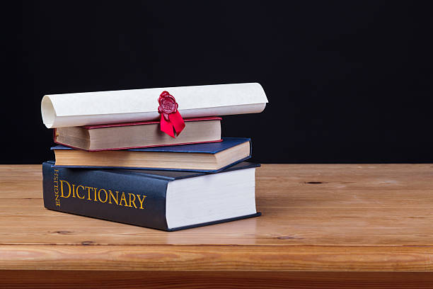 istock School desk with dictionary black background 503174731