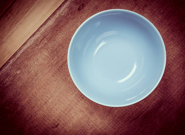 istock Round plate with blue on wood table 503178857