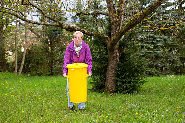 istock older woman with dustbin 503180235