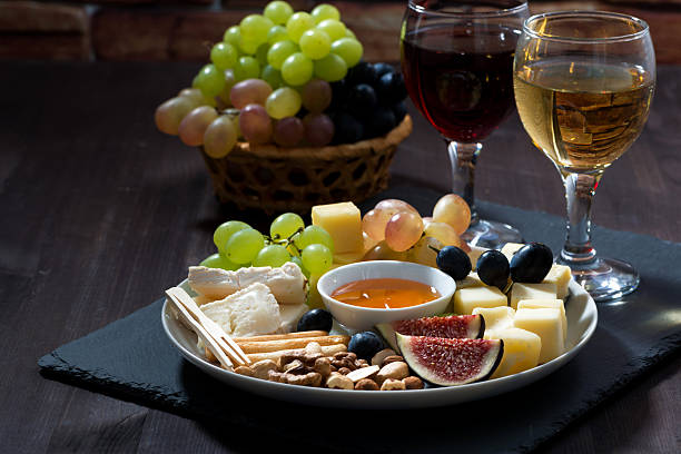 istock Plate with deli snacks and glasses of wine 503185264