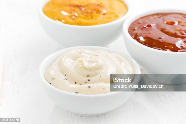 Assortment Various Sauces In Bowls On White Table Stock Photo - Download Image Now - Savory Sauce, Antipasto, Appetizer