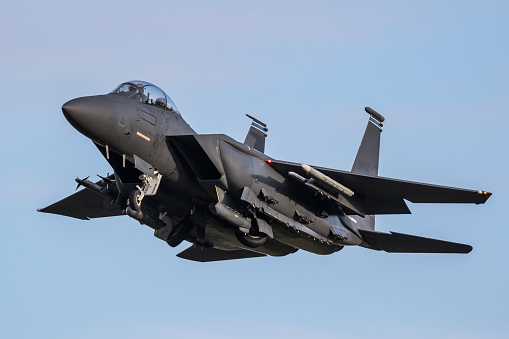 F15E Strike Eagle comes in with its landing gear raising. All notable markings have been removed.