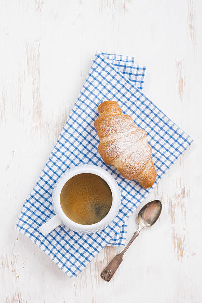 istock espresso and fresh croissant, top view 503186030