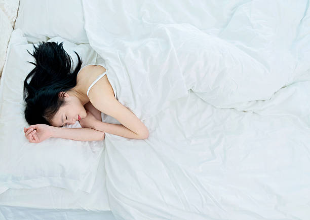 istock Beautiful young asian woman sleeping 503186286
