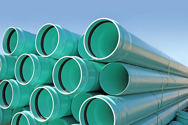 istock Stacked PVC Pipe Sections On A New Road Construction Site 503188508