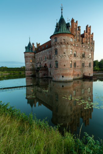 Egeskov, Denmark - July 16, 2014: Egeskov castle, and it's reflection in the lake.