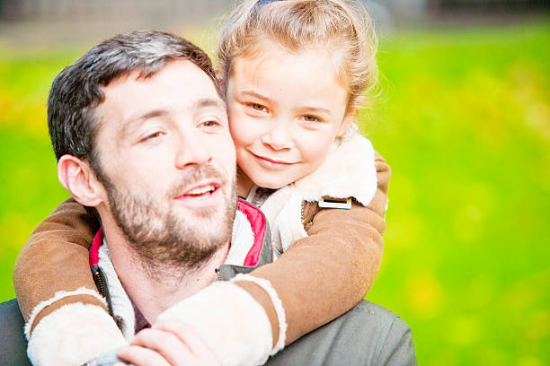 istock Father and daughter in a London`s park 503189965