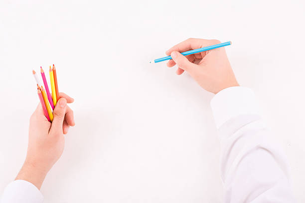 istock Male hands with colored pencils 503191130