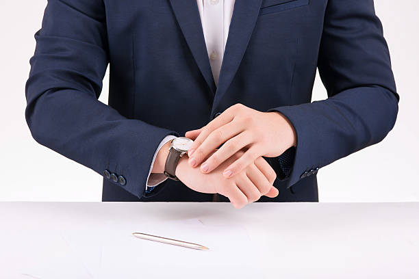 istock Businessperson adjusting his wristwatch 503191170