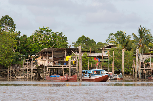 Paramaribo, Suriname - March 18, 2013: Fishing village and fishing boats on the Suriname River near Paramaribo.